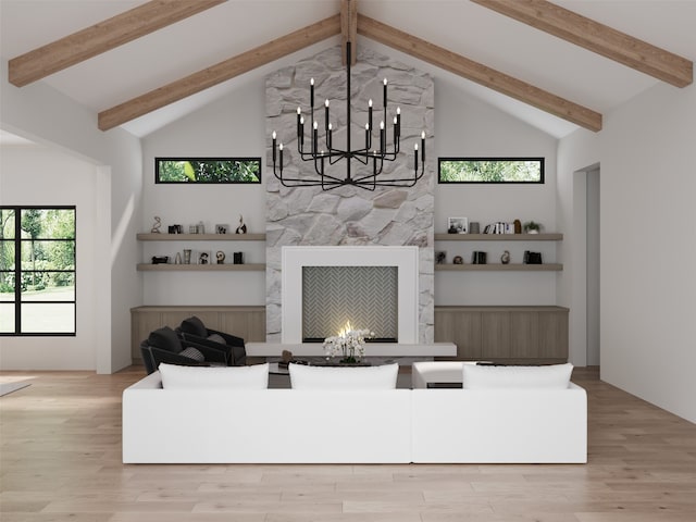 interior space featuring a wealth of natural light, light hardwood / wood-style flooring, high vaulted ceiling, and a fireplace