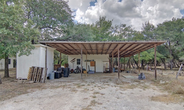 view of vehicle parking featuring a carport