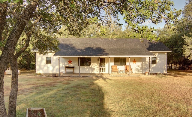 view of front facade with a front lawn and a porch