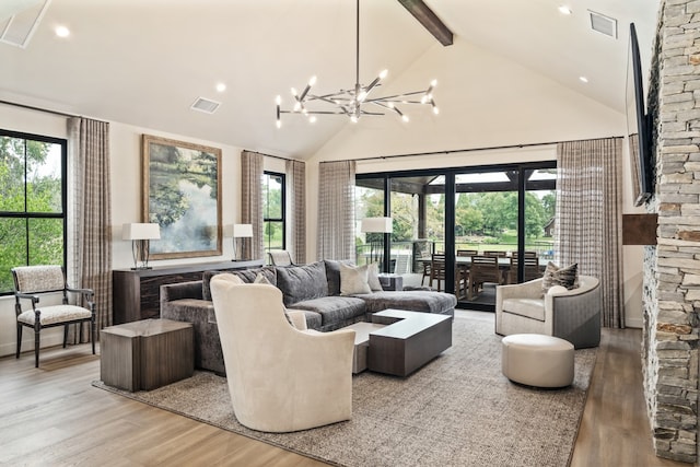 living room featuring plenty of natural light and light hardwood / wood-style flooring