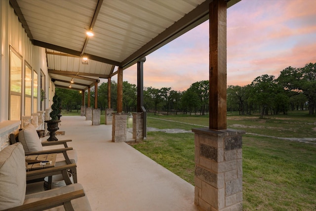 patio terrace at dusk with a lawn