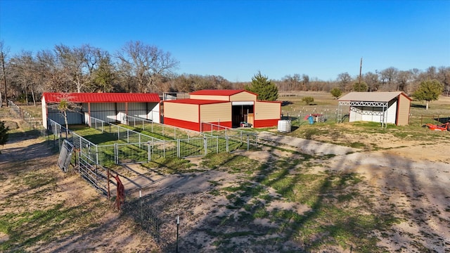 view of yard featuring a rural view and an outdoor structure