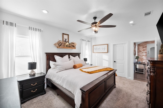 bedroom with ceiling fan and light colored carpet