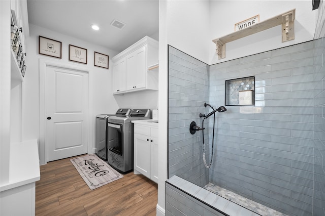 laundry area featuring cabinets and independent washer and dryer