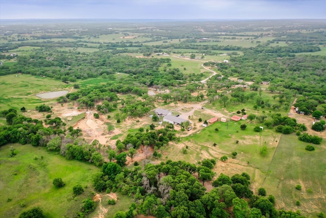 birds eye view of property with a rural view