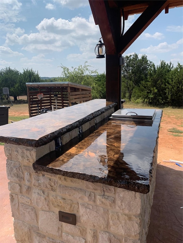 view of patio / terrace with an outdoor bar