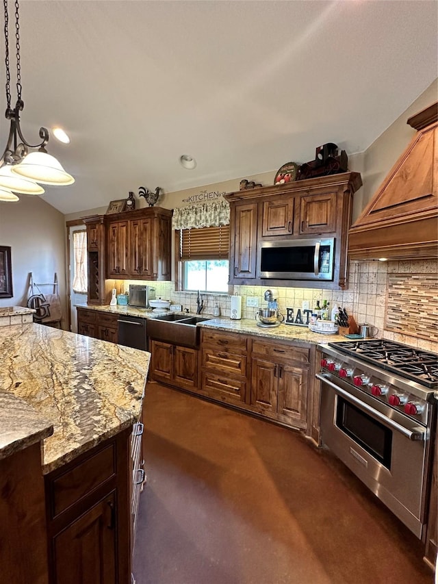 kitchen featuring tasteful backsplash, light stone counters, decorative light fixtures, appliances with stainless steel finishes, and custom exhaust hood