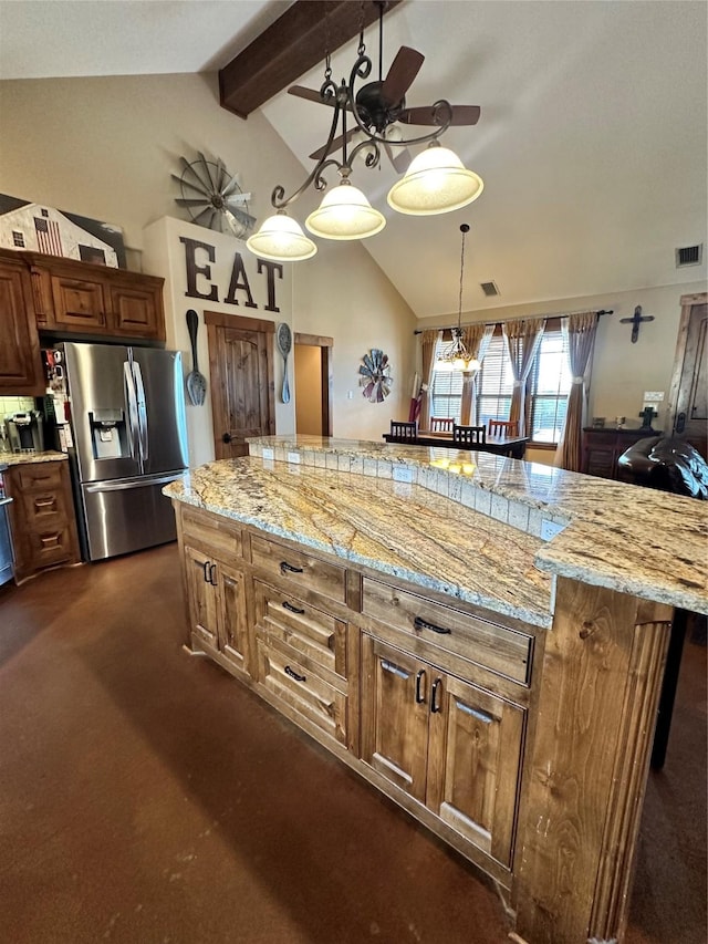 kitchen with stainless steel fridge, light stone counters, dark colored carpet, lofted ceiling with beams, and decorative light fixtures