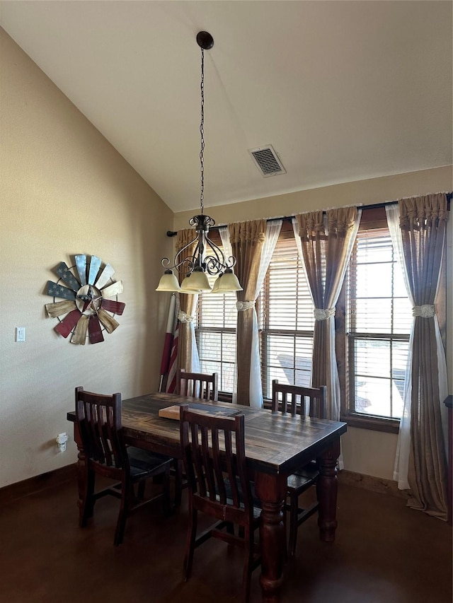 dining space featuring lofted ceiling