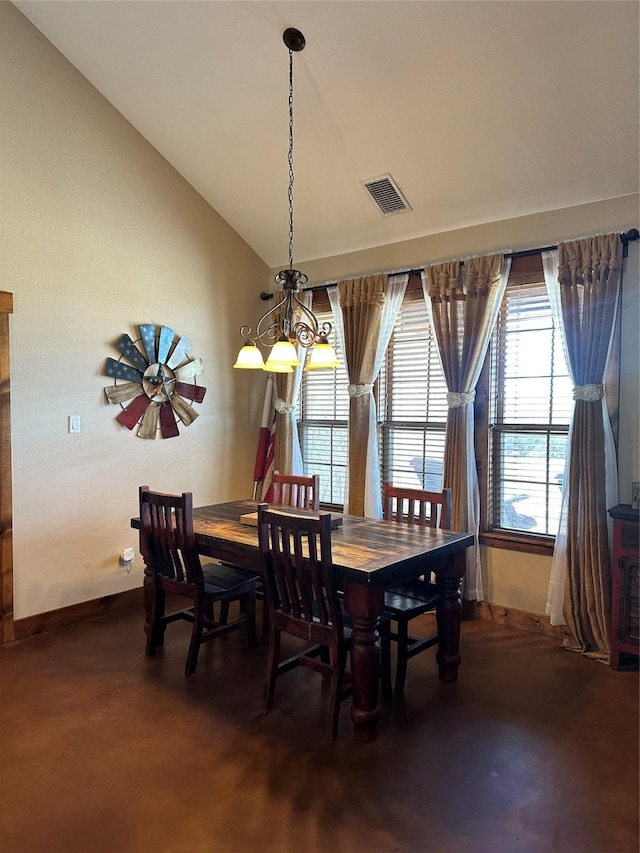 dining room featuring a chandelier and vaulted ceiling