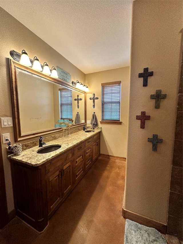 bathroom featuring vanity and a textured ceiling