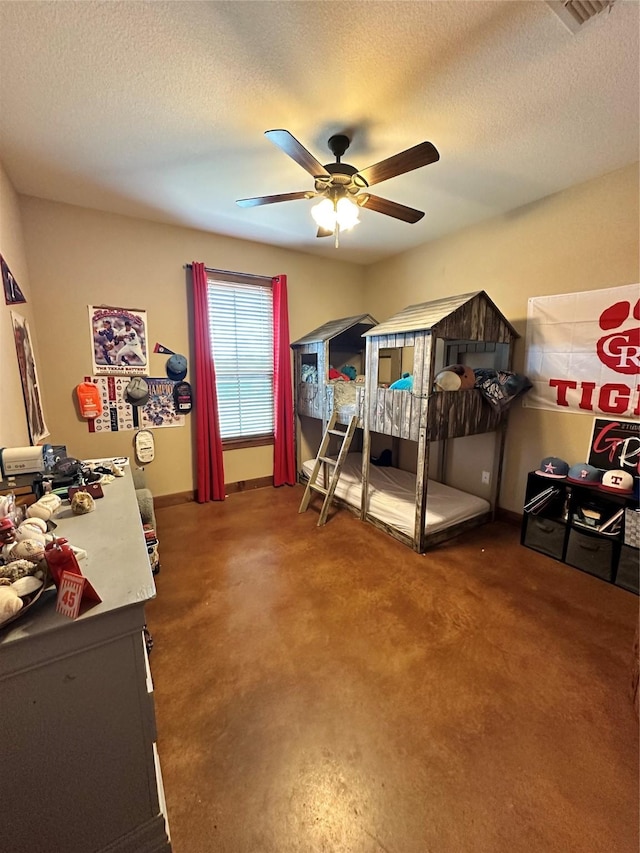 bedroom with a textured ceiling and ceiling fan