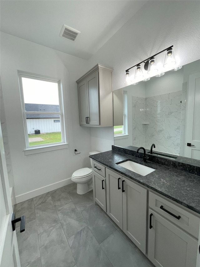 1428 Dixie Estates Way, Whitesboro, TX 76273 - full bath with a marble finish shower, vanity, toilet, and baseboards