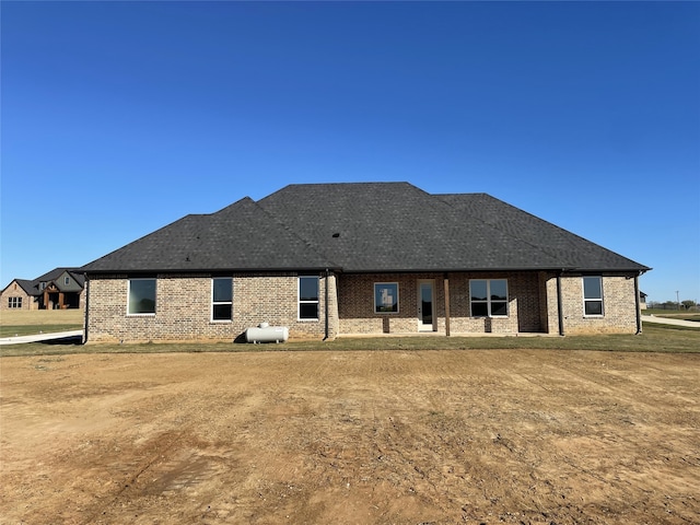 1428 Dixie Estates Way, Whitesboro, TX 76273 - rear view of property featuring brick siding