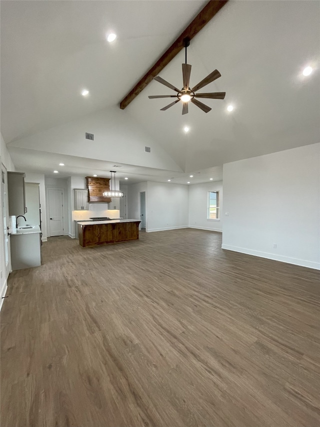 1428 Dixie Estates Way, Whitesboro, TX 76273 - unfurnished living room with beamed ceiling, dark wood-style flooring, ceiling fan, baseboards, and high vaulted ceiling