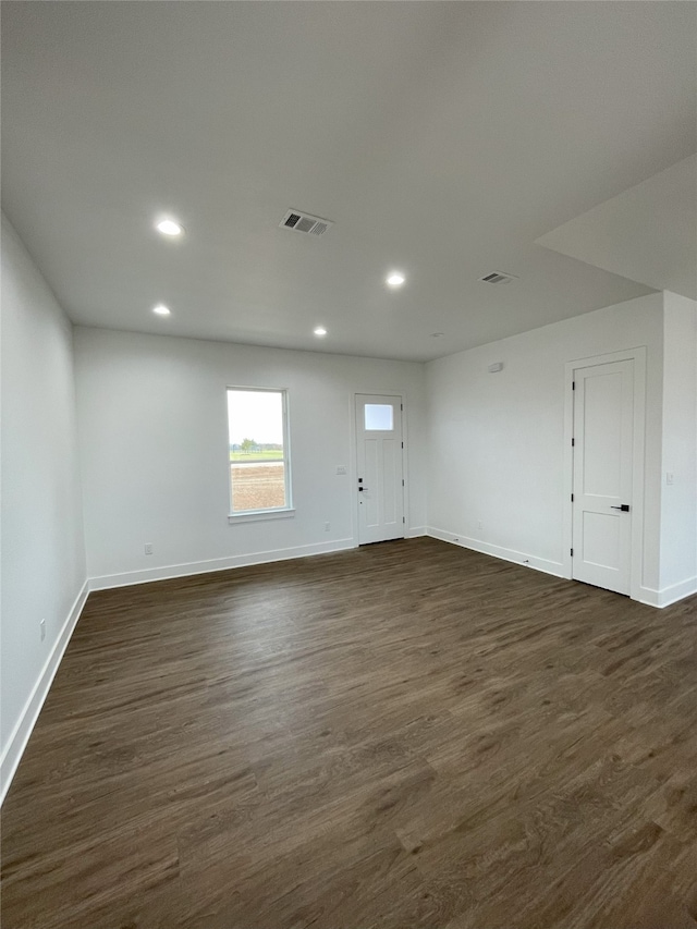 1428 Dixie Estates Way, Whitesboro, TX 76273 - empty room featuring recessed lighting, baseboards, and dark wood finished floors
