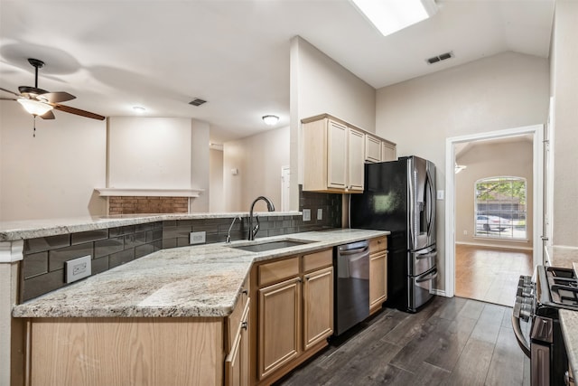 kitchen with decorative backsplash, vaulted ceiling, dark hardwood / wood-style floors, sink, and stainless steel appliances