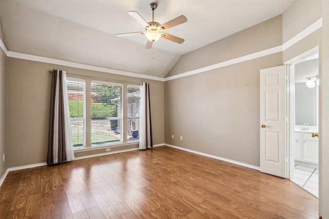 unfurnished room featuring lofted ceiling, light hardwood / wood-style flooring, and ceiling fan