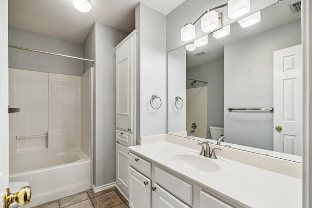 full bathroom featuring toilet, vanity, bathing tub / shower combination, and tile patterned floors