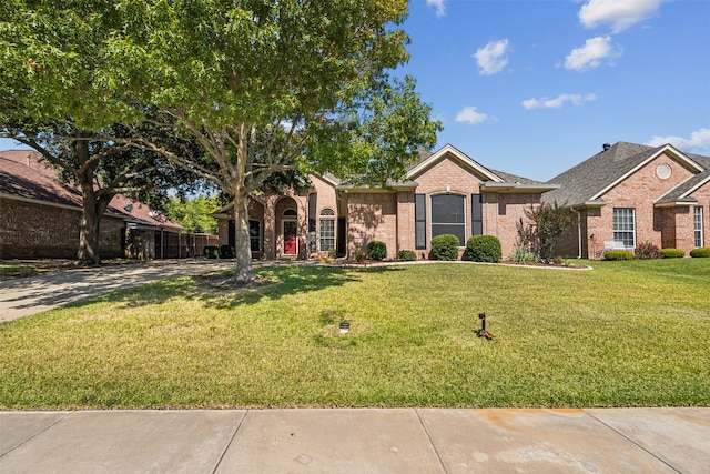 ranch-style home with a front yard