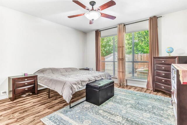 bedroom featuring light wood-type flooring and ceiling fan