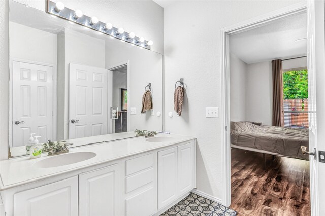 bathroom featuring hardwood / wood-style flooring and vanity