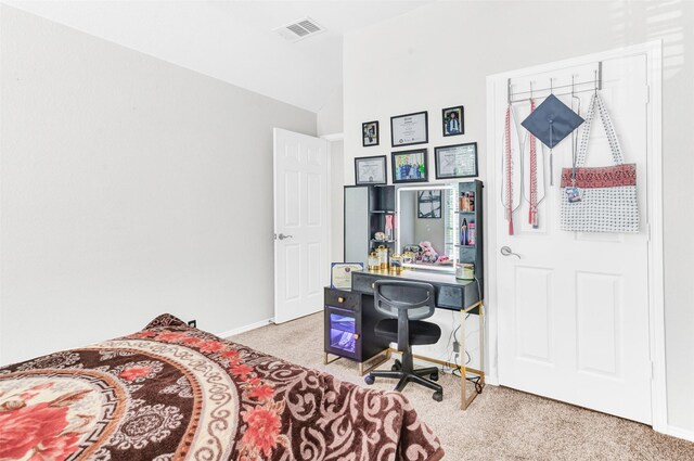 carpeted bedroom featuring lofted ceiling