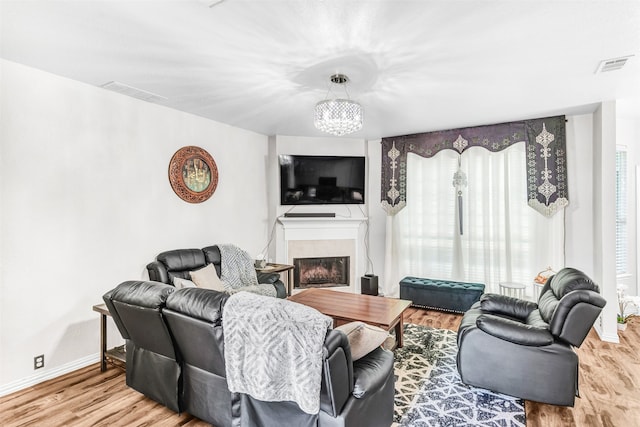 living room featuring hardwood / wood-style flooring and a chandelier