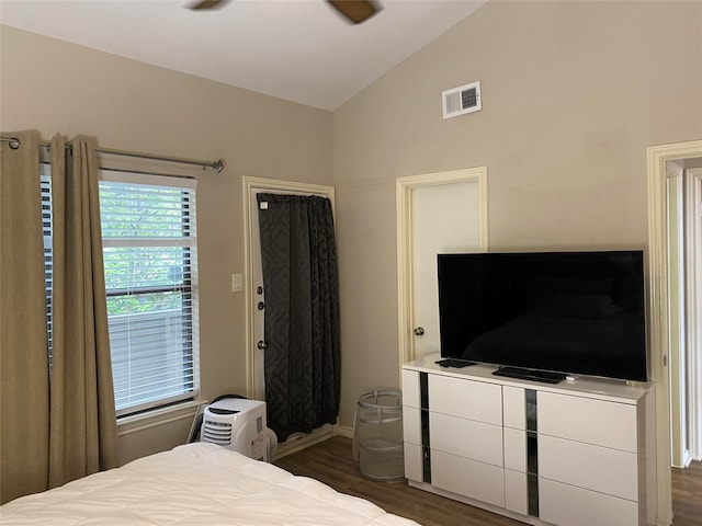 bedroom featuring lofted ceiling, dark wood-type flooring, and ceiling fan