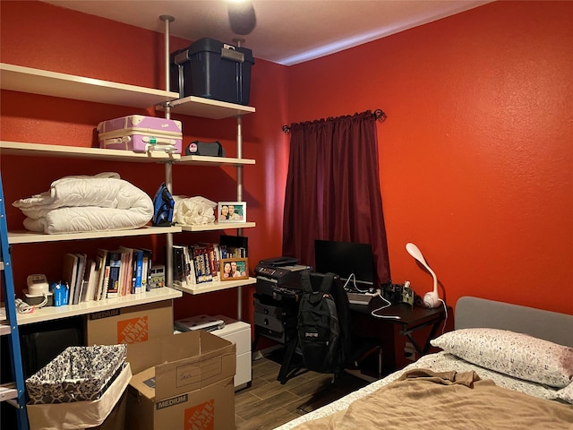 bedroom with ceiling fan and dark hardwood / wood-style floors