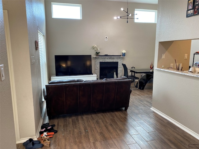 living room featuring hardwood / wood-style flooring and a notable chandelier