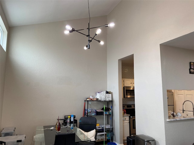 office area featuring a notable chandelier and sink