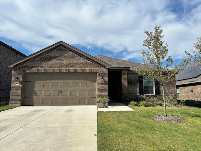 view of front facade with a garage, driveway, a front lawn, and brick siding