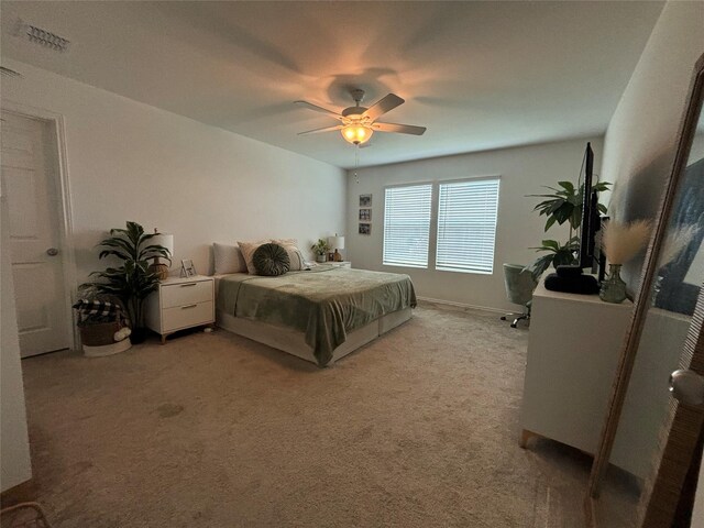 bedroom featuring ceiling fan and carpet flooring