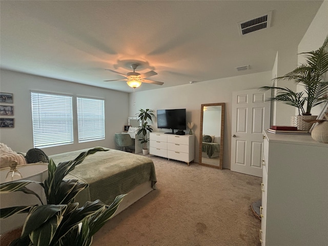 bedroom featuring light carpet and ceiling fan