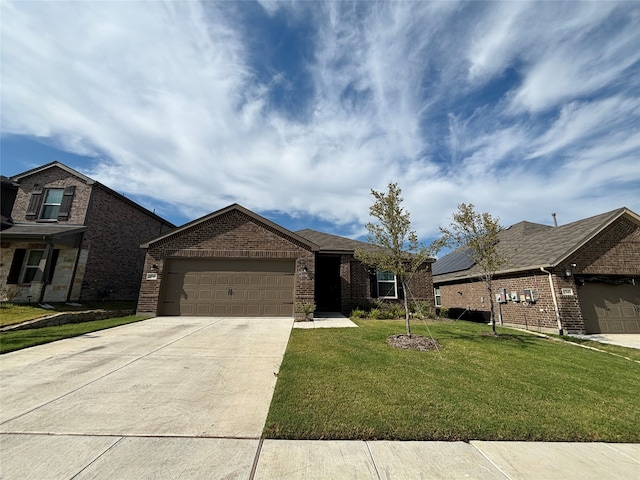 view of front of house featuring a garage and a front lawn