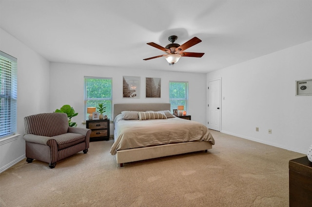 carpeted bedroom featuring ceiling fan