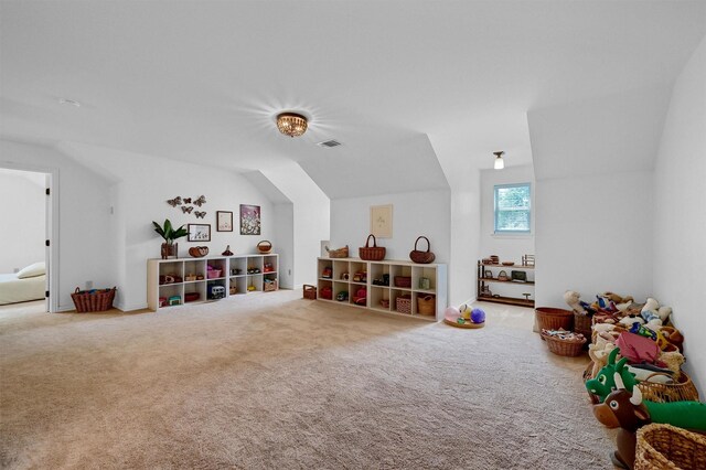 game room with carpet floors and vaulted ceiling