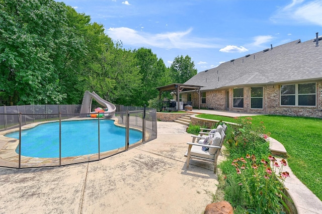 view of pool featuring a water slide and a patio area