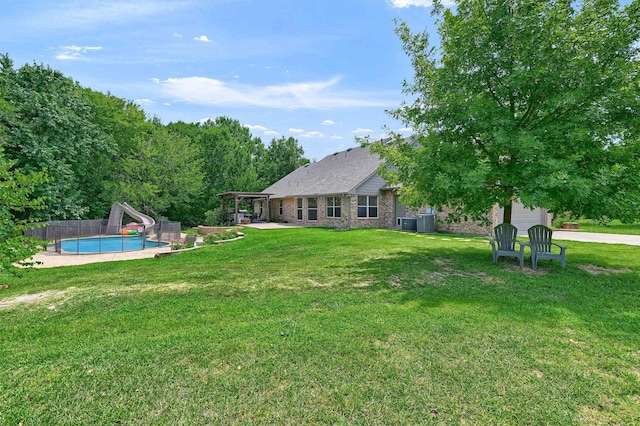 view of yard featuring a patio, an outdoor pool, and a pergola