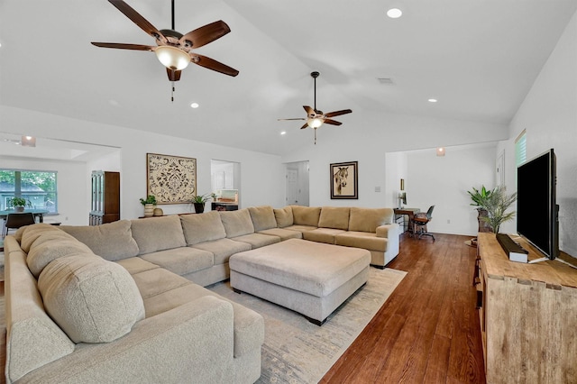 living room with lofted ceiling, wood finished floors, a ceiling fan, and recessed lighting