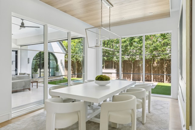 sunroom / solarium with a wealth of natural light and wooden ceiling