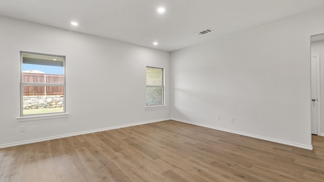 empty room with hardwood / wood-style floors