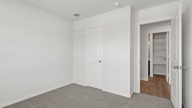 unfurnished bedroom with carpet floors