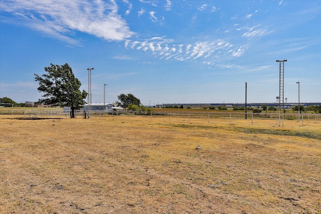 view of yard with a rural view