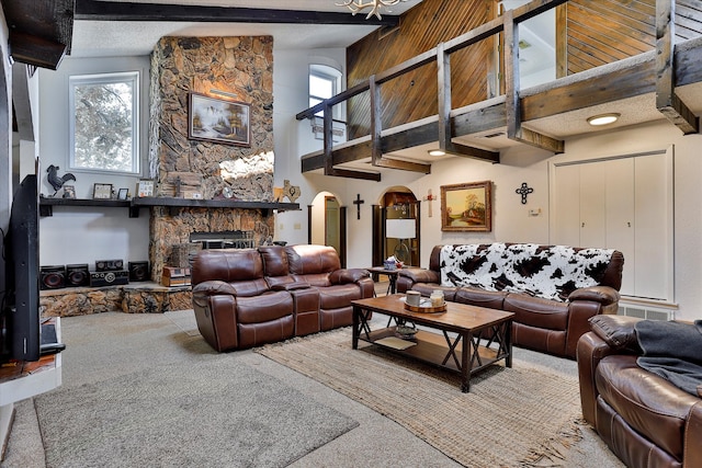 carpeted living room with high vaulted ceiling, beam ceiling, and a fireplace