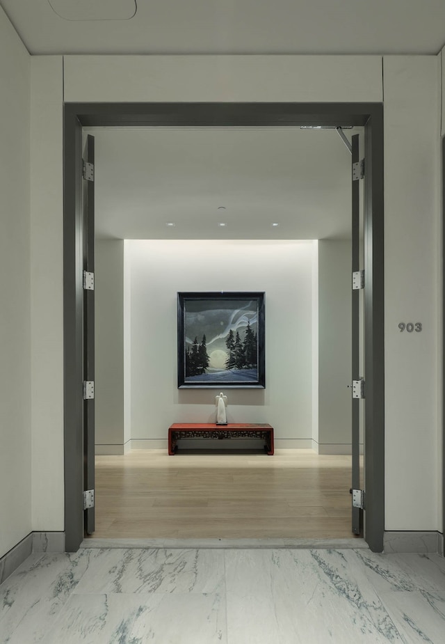 hallway featuring hardwood / wood-style flooring