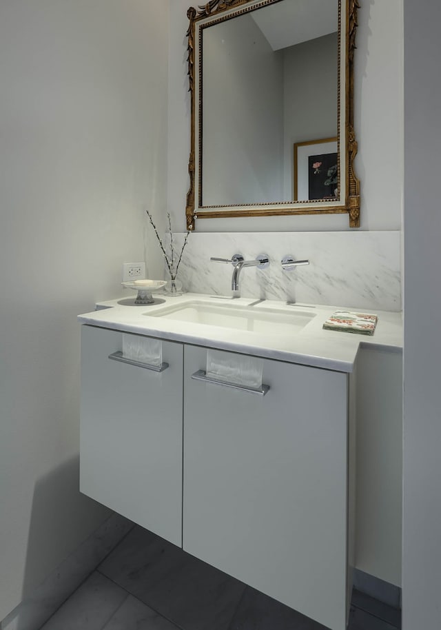 bathroom with decorative backsplash and vanity