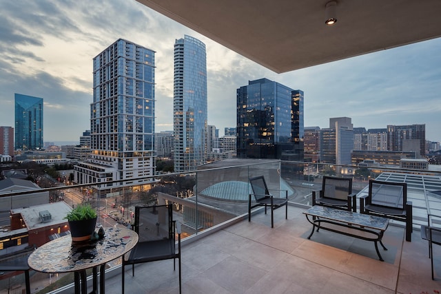 view of patio featuring a balcony