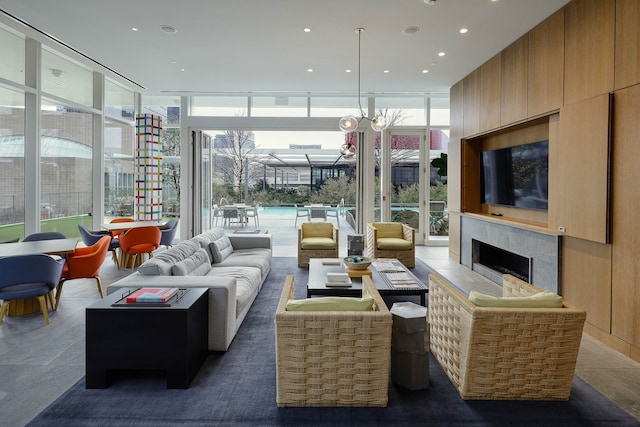 interior space with plenty of natural light, a notable chandelier, and a fireplace